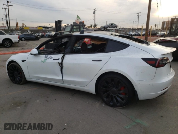 2022 Tesla Model 3 Performance with VIN 5YJ3E1EC3NF265334, listed as a Copart auction lot 84853734 with Not Provided miles and Salvage Title. Bid and sale history available at DreamBid. Image 2.