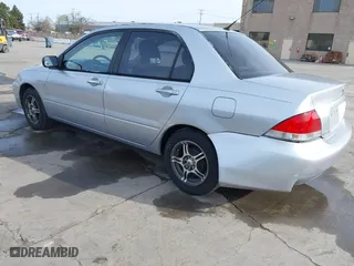 2004 Mitsubishi Lancer ES with VIN JA3AJ26E54U052124, listed as a IAAI auction lot 41804473 with 165,786 mi miles. Bid and sale history available at carsss.com. Image 3.