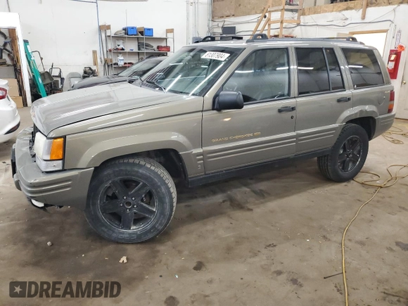 1996 Jeep Grand Cherokee Limited z VIN 1J4GZ78S5TC210710, wystawiony jako Copart lot #81307904 z przebiegiem 285 169 mil mil oraz Szkoda całkowita • Salvage title. Historia ofert i sprzedaży dostępna na DreamBid. Obrazek 1.