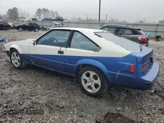 1984 Toyota Supra z VIN JT2MA67L5E0133497, wystawiony jako Copart lot #43439285 z przebiegiem 187 882 mil mil oraz Czysty tytuł • Clean title. Historia ofert i sprzedaży dostępna na DreamBid. Obrazek 2.