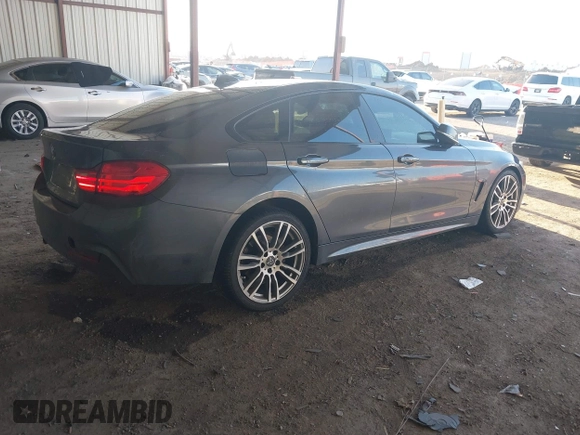 2015 BMW 4 Series 428i with VIN WBA4A5C54FG051307, listed as a IAAI auction lot 41774596 with 126,852 mi miles and . Bid and sale history available at carsss.com. Image 4.