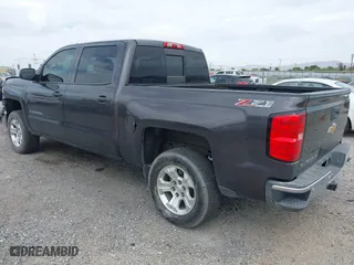 2014 Chevrolet Silverado 1500 LT with VIN 3GCUKREC7EG561639, listed as a IAAI auction lot 42020364 with 154,785 mi miles. Bid and sale history available at carsss.com. Image 3.