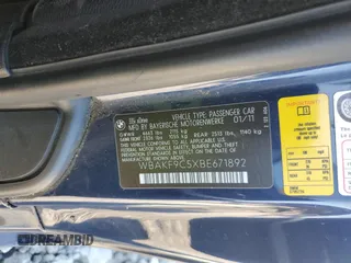 2011 BMW 3 Series 335i xDrive with VIN WBAKF9C5XBE671892, listed as a Copart auction lot 52422964 with 82,884 mi miles and Salvage Title. Bid and sale history available at carsss.com. Image 12.
