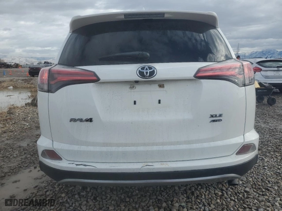 2018 Toyota RAV4 XLE with VIN JTMRFREV6JJ236467, listed as a Copart auction lot 86702854 with 82,040 mi miles and Salvage Title. Bid and sale history available at carsss.com. Image 6.
