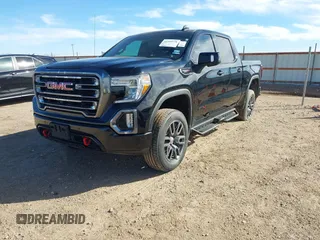 2021 GMC Sierra 1500 AT4 with VIN 1GTU9EETXMZ230606, listed as a IAAI auction lot 41599778 with 128,745 mi miles. Bid and sale history available at carsss.com. Image 2.