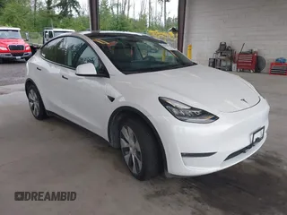 2023 Tesla Model Y Long Range with VIN 7SAYGDEE2PF589447, listed as a IAAI auction lot 42293949 with 28,897 mi miles and . Bid and sale history available at DreamBid. Image 1.