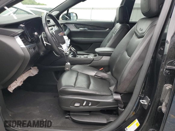 2020 Cadillac XT6 FWD Premium Luxury with VIN 1GYKPCRSXLZ154638, listed as a Copart auction lot 57439835 with 142,435 mi miles and Salvage title. Bid and sale history available at DreamBid. Image 7.