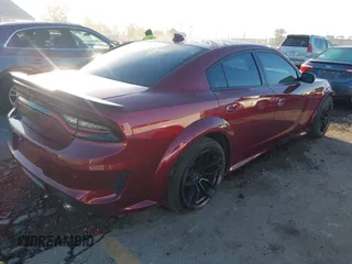 2022 Dodge Charger Scat Pack Widebody with VIN 2C3CDXGJ5NH189146, listed as a IAAI auction lot 41603805 with 30,212 mi miles and . Bid and sale history available at DreamBid. Image 4.