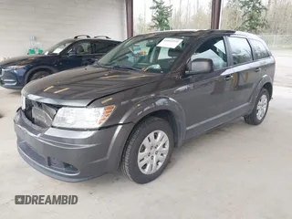 2015 Dodge Journey SE z VIN 3C4PDCAB1FT617794, wystawiony jako IAAI lot #41922371 z przebiegiem 130 558 mil mil oraz . Historia ofert i sprzedaży dostępna na DreamBid. Obrazek 2.