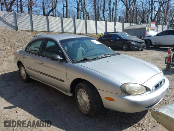 1999 Mercury Sable LS z VIN 1MEFM53S7XA622932, wystawiony jako IAAI lot #41708531 z przebiegiem 155 702 mil mil oraz . Historia ofert i sprzedaży dostępna na DreamBid. Obrazek 1.