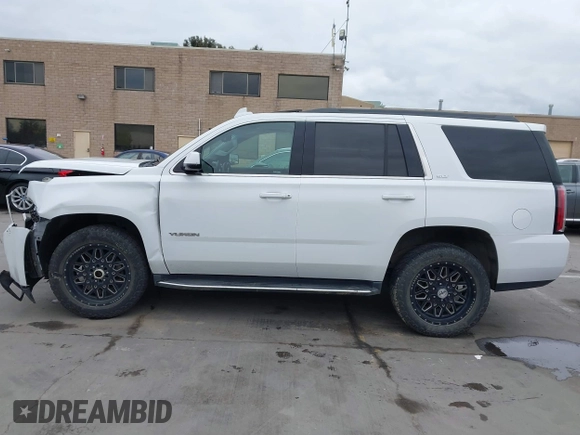 2019 GMC Yukon SLT with VIN 1GKS2BKC3KR160060, listed as a IAAI auction lot 42042122 with 124,733 mi miles. Bid and sale history available at carsss.com. Image 15.