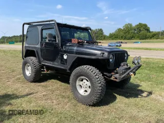 1999 Jeep Wrangler Sahara with VIN 1J4FY49S5XP496486, listed as a Copart auction lot 77263014 with 128,498 mi miles and Clean Title. Bid and sale history available at carsss.com. Image 1.