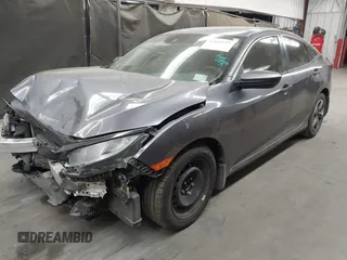 2020 Honda Civic LX with VIN 19XFC2F67LE006057, listed as a IAAI auction lot 42032759 with 119,319 mi miles and . Bid and sale history available at DreamBid. Image 18.