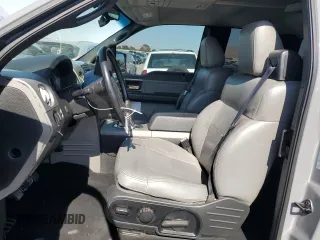2004 Ford F-150 XLT with VIN 1FTPX14584NA82865, listed as a Copart auction lot 64094845 with 218,027 mi miles and Salvage title. Bid and sale history available at DreamBid. Image 7.