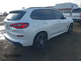 2021 BMW X5 sDrive40i with VIN 5UXCR4C00M9D80482, listed as a IAAI auction lot 41636009 with 85,103 mi miles. Bid and sale history available at carsss.com. Image 4.