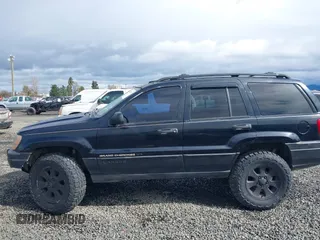 2001 Jeep Grand Cherokee Laredo with VIN 1J4GW48N61C642351, listed as a IAAI auction lot 41783127 with 194,578 mi miles and . Bid and sale history available at DreamBid. Image 6.