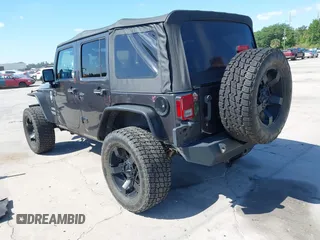 2014 Jeep Wrangler Unlimited Sport with VIN 1C4BJWDG4EL295044, listed as a IAAI auction lot 41997837 with 143,447 mi miles. Bid and sale history available at carsss.com. Image 3.