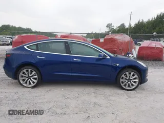 2018 Tesla Model 3 Long Range Battery z VIN 5YJ3E1EBXJF088444, wystawiony jako IAAI lot #42072860 z przebiegiem 46 063 mil mil oraz . Historia ofert i sprzedaży dostępna na DreamBid. Obrazek 13.