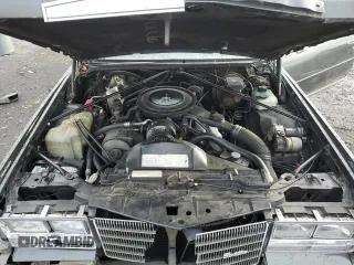 1984 Cadillac Eldorado z VIN 1G6AL5781EE619594, wystawiony jako Copart lot #80918934 z przebiegiem 47 529 mil mil oraz Szkody całkowita. Historia ofert i sprzedaży dostępna na DreamBid. Obrazek 11.