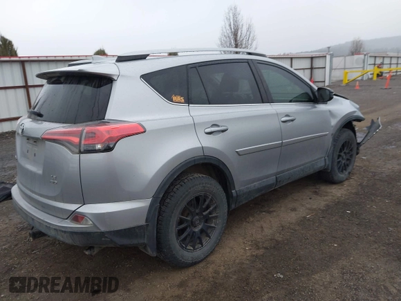2018 Toyota RAV4 LE with VIN 2T3BFREV9JW724606, listed as a IAAI auction lot 41862028 with 98,590 mi miles. Bid and sale history available at carsss.com. Image 4.