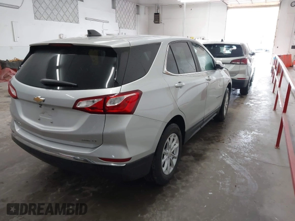 2021 Chevrolet Equinox LT with VIN 3GNAXTEV6MS161013, listed as a IAAI auction lot 41913023 with 68,969 mi miles and . Bid and sale history available at DreamBid. Image 4.