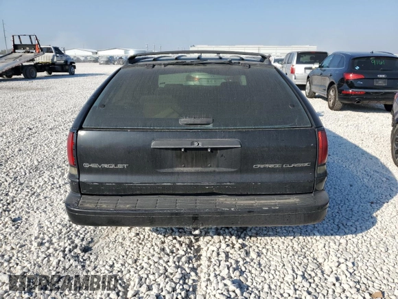 1996 Chevrolet Caprice with VIN 1G1BL82P2TR106404, listed as a Copart auction lot 74213214 with 156,588 mi miles and Salvage title. Bid and sale history available at DreamBid. Image 6.