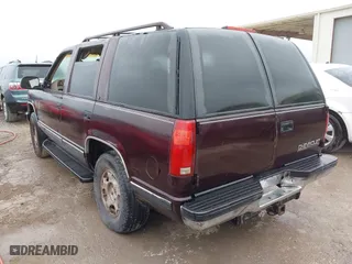 1997 Chevrolet Tahoe with VIN 1GNEK13R8VJ329165, listed as a IAAI auction lot 41631672 with 166,976 mi miles. Bid and sale history available at carsss.com. Image 3.