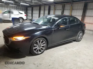 2019 Mazda 3 Premium with VIN 3MZBPAEM7KM102348, listed as a Copart auction lot 84587534 with 73,125 mi miles and Salvage Title. Bid and sale history available at DreamBid. Image 1.