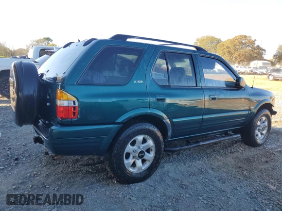 1999 Isuzu Rodeo S с VIN 4S2CK58W6X4352441, выставлен на аукционе Copart как лот 81915384 с пробегом 338 513 миль миль и На запчасти • Non repairable. История ставок и продаж доступна на DreamBid. Изображение 3.