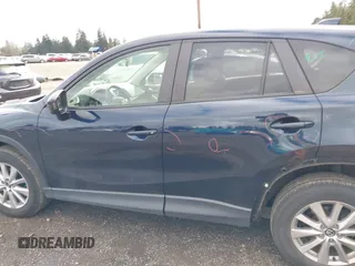 2015 Mazda CX-5 Touring with VIN JM3KE4CY5F0453646, listed as a IAAI auction lot 41740574 with 91,167 mi miles. Bid and sale history available at carsss.com. Image 15.