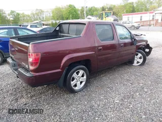 2010 Honda Ridgeline RTL with VIN 5FPYK1F57AB005602, listed as a IAAI auction lot 42208633 with 106,777 mi miles and . Bid and sale history available at DreamBid. Image 4.