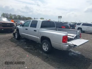 2007 Dodge Dakota SLT with VIN 1D7HE48KX7S122712, listed as a IAAI auction lot 41888864 with 114,384 mi miles and . Bid and sale history available at carsss.com. Image 3.