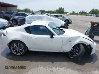 2023 Mazda MX-5 Miata Grand Touring с VIN JM1NDAM71P0560062, выставлен на аукционе IAAI как лот 42065123 с пробегом 11 320 миль миль и . История ставок и продаж доступна на DreamBid. Изображение 13.