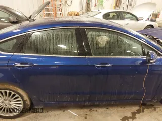 2013 Ford Fusion Titanium Hybrid with VIN 3FA6P0RU9DR320909, listed as a IAAI auction lot 41477530 with 108,153 mi miles. Bid and sale history available at carsss.com. Image 13.