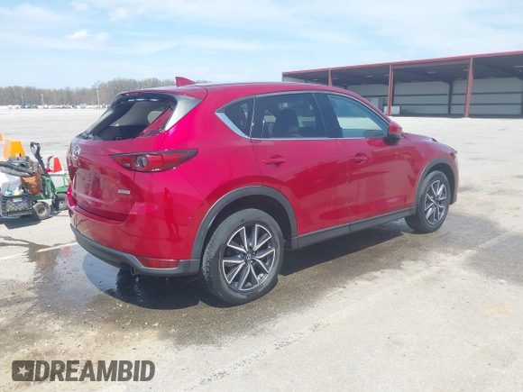2018 Mazda CX-5 Grand Touring with VIN JM3KFBDM6J0424663, listed as a IAAI auction lot 42003207 with 95,442 mi miles and . Bid and sale history available at DreamBid. Image 4.