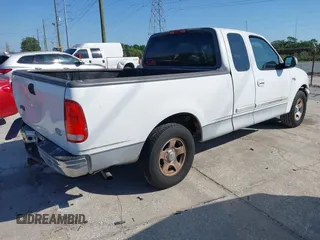 2002 Ford F-150 XL with VIN 1FTRX17WX2NA92467, listed as a IAAI auction lot 41977334 with 176,902 mi miles. Bid and sale history available at carsss.com. Image 4.