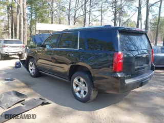 2015 Chevrolet Tahoe LTZ with VIN 1GNSKCKC2FR101306, listed as a IAAI auction lot 41909631 with 218,102 mi miles. Bid and sale history available at carsss.com. Image 3.
