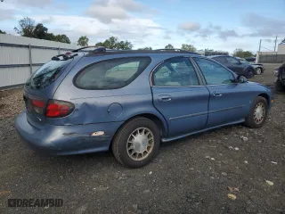 1999 Ford Taurus SE with VIN 1FAFP58S2XA261374, listed as a Copart auction lot 74180494 with 193,416 mi miles and Salvage Title. Bid and sale history available at carsss.com. Image 3.