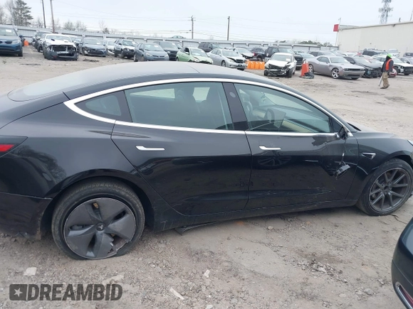 2019 Tesla Model 3 Mid Range with VIN 5YJ3E1EA5KF297213, listed as a IAAI auction lot 41361412 with 93,801 mi miles and . Bid and sale history available at carsss.com. Image 13.