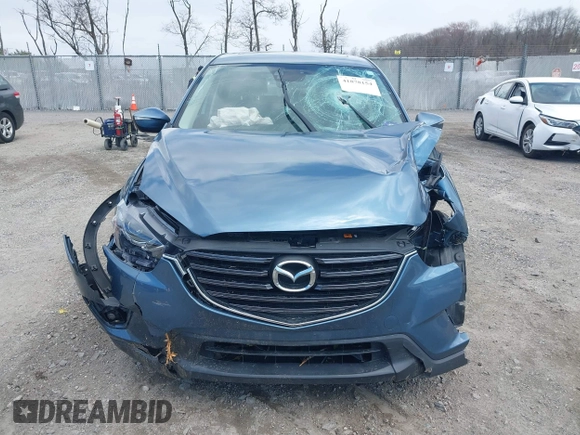 2016 Mazda CX-5 Grand Touring with VIN JM3KE4DY0G0629924, listed as a IAAI auction lot 41878154 with 78,196 mi miles. Bid and sale history available at carsss.com. Image 12.