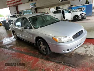 2005 Ford Taurus SE with VIN 1FAFP53215A133518, listed as a Copart auction lot 59615205 with 127,778 mi miles and Salvage title. Bid and sale history available at DreamBid. Image 4.