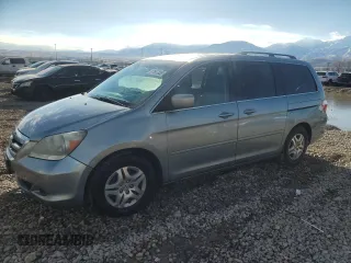 2007 Honda Odyssey EX-L with VIN 5FNRL38647B023186, listed as a Copart auction lot 87697035 with 190,884 mi miles and Salvage Title. Bid and sale history available at carsss.com. Image 1.