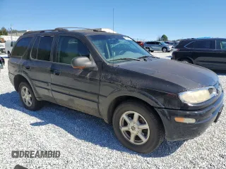 2003 Oldsmobile Bravada z VIN 1GHDT13S732245893, wystawiony jako Copart lot #76522314 z przebiegiem 238 130 mil mil oraz Tytuł czysty. Historia ofert i sprzedaży dostępna na DreamBid. Obrazek 4.