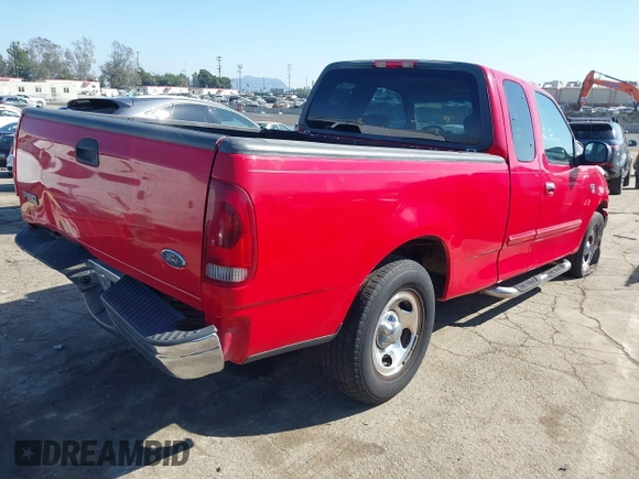 2002 Ford F-150 XL with VIN 1FTRX17W52NA81828, listed as a IAAI auction lot 41450811 with 201,948 mi miles. Bid and sale history available at carsss.com. Image 4.