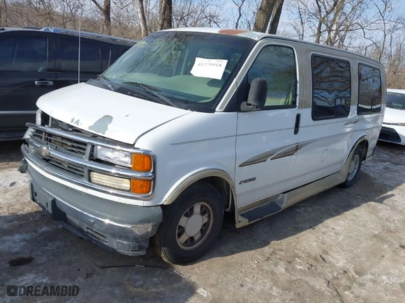 1999 Chevrolet Express Van with VIN 1GBFG15RXX1047502, listed as a IAAI auction lot 41379918 with 101,936 mi miles. Bid and sale history available at carsss.com. Image 2.