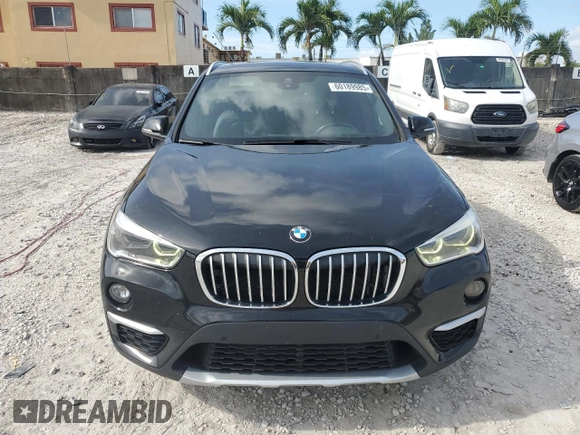 2019 BMW X1 xDrive28i with VIN WBXHT3C59K5L36435, listed as a Copart auction lot 60189985 with 105,110 mi miles and Salvage title. Bid and sale history available at DreamBid. Image 5.