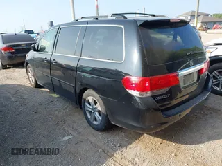 2010 Honda Odyssey Touring with VIN 5FNRL3H96AB031016, listed as a IAAI auction lot 42828397 with 261,881 mi miles and . Bid and sale history available at DreamBid. Image 3.