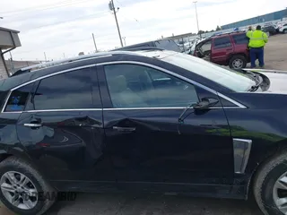 2013 Cadillac SRX Luxury Collection z VIN 3GYFNCE35DS607553, wystawiony jako IAAI lot #42151522 z przebiegiem 104 688 mil mil oraz . Historia ofert i sprzedaży dostępna na DreamBid. Obrazek 13.