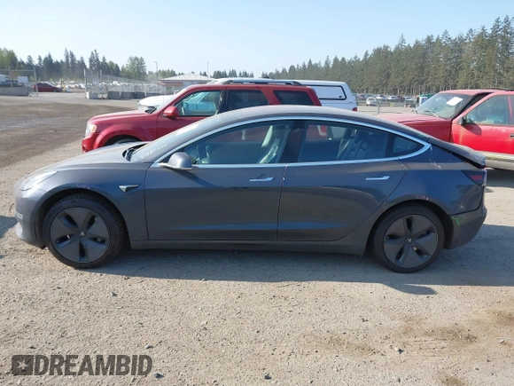 2018 Tesla Model 3 Long Range Battery with VIN 5YJ3E1EA1JF021139, listed as a IAAI auction lot 42116626 with 83,003 mi miles and . Bid and sale history available at DreamBid. Image 14.