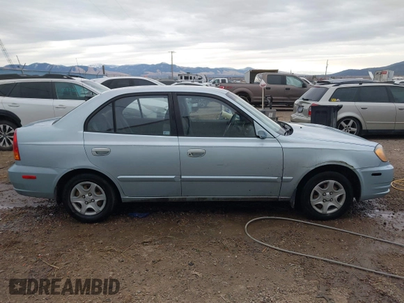 2003 Hyundai Accent GL z VIN KMHCG45C43U465523, wystawiony jako IAAI lot #40883056 z przebiegiem 95 770 mil mil oraz . Historia ofert i sprzedaży dostępna na DreamBid. Obrazek 13.